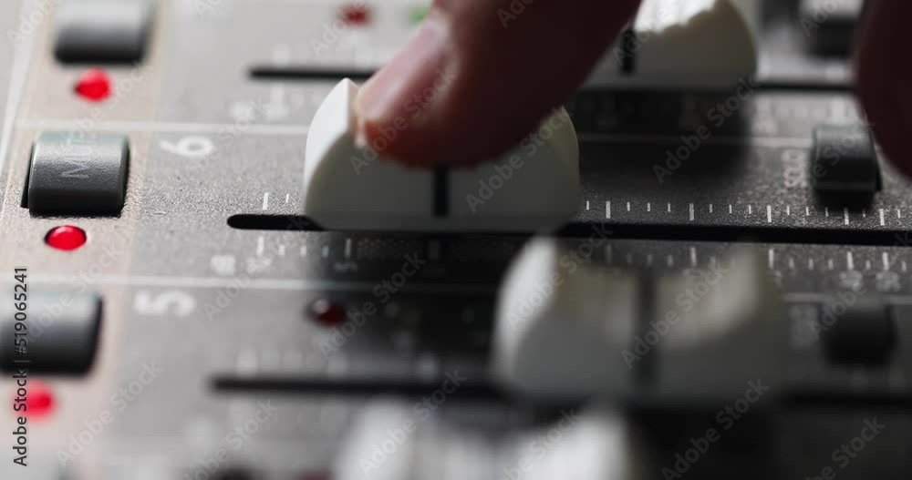 Mixing Console, Finger On Channel Fader Gradually Increasing And Decreasing Level Of An Audio Signal. - close up Mixing Console, Finger On Channel Fader Gradually Increasing And Decreasing Level Of An Audio Signal. - close up