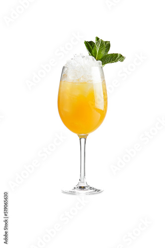 Fruit alcoholic cocktail with mint and ice on white background. Citrus lemonade in wine glass. Fresh cocktail with orange and mango. Summer drinks in restaurant menu.