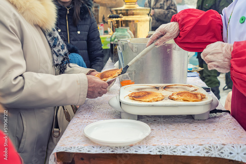 cooking flatbread on the street to feed the homeless refugees