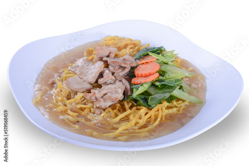 crispy yellow noodle with in a creamy gravy sauce : chinese and thai style food. in thai language call is " Rad Na Mee Krob" on white bowl and isolate background with clipping path
