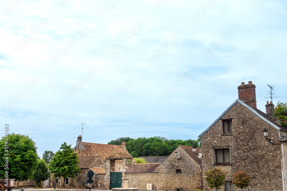 Antique building view in Janvry, France Antique building view in Janvry, France