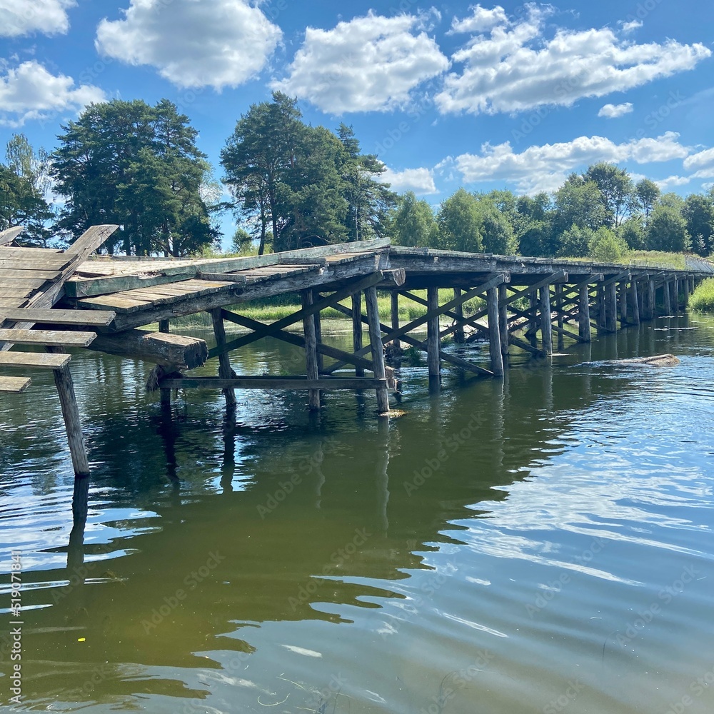Destroyed old wooden bridge on the Ruza River in Russia Destroyed old wooden bridge on the Ruza River in Russia