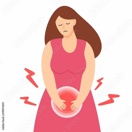 A sad girl with abdominal pain is holding her stomach. Menstruation, cystitis and other diseases in gynecology.