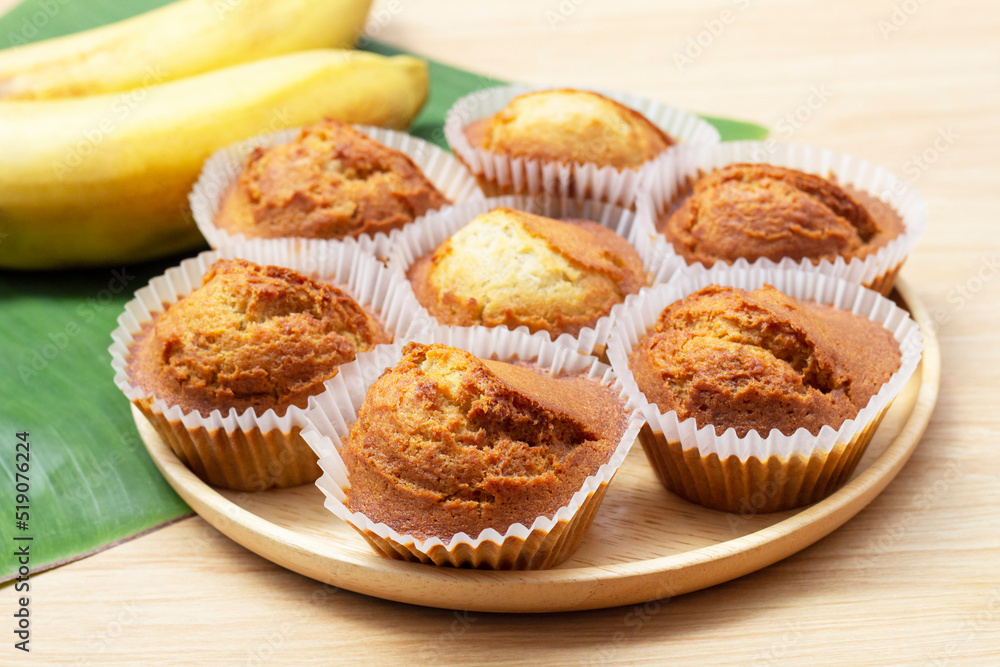Sweet Banana muffins in wooden plate on the table. Sweet Banana muffins in wooden plate on the table.