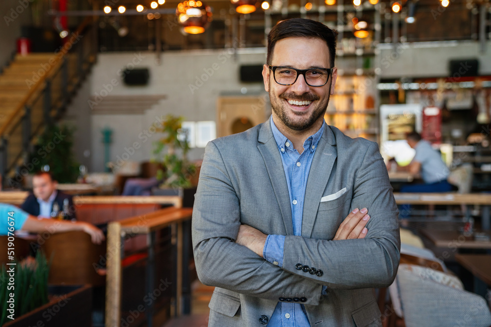 Portrait of happy successful businessman. Satisfied man feeling confident in a creative office. Portrait of happy successful businessman. Satisfied man feeling confident in a creative office.