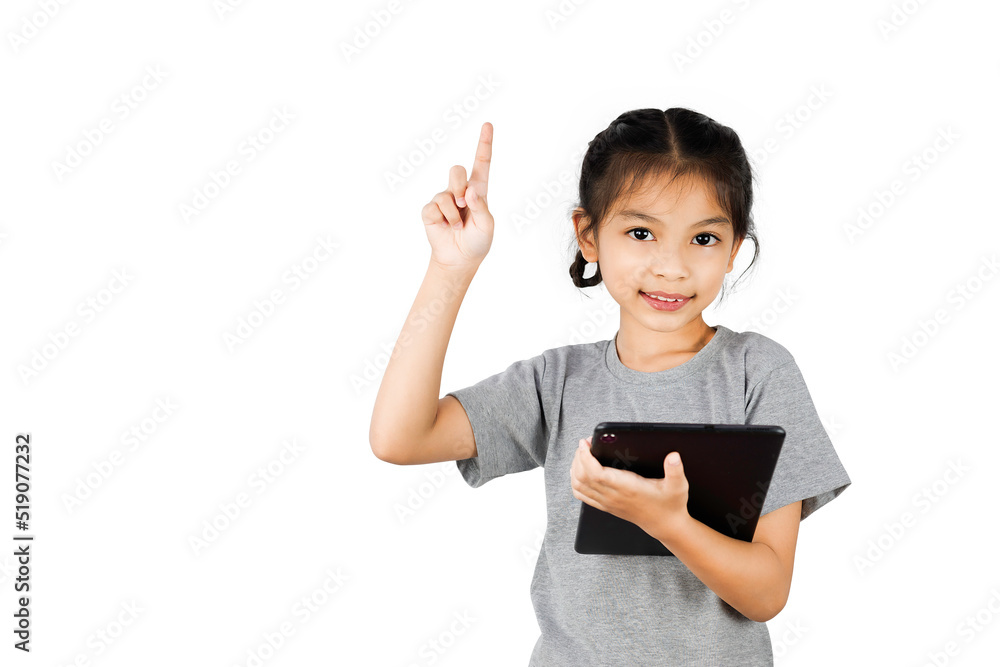 Little girl playing with a digital tablet isolated on white background. Little girl playing with a digital tablet isolated on white background.