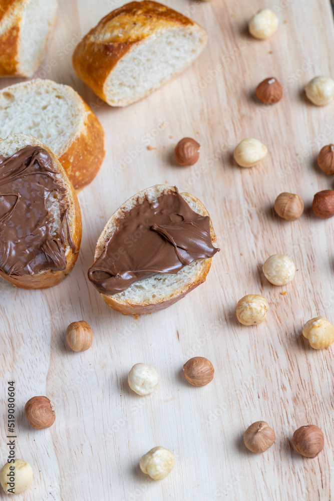 Fototapeta premium chocolate butter spread on a baguette, close up