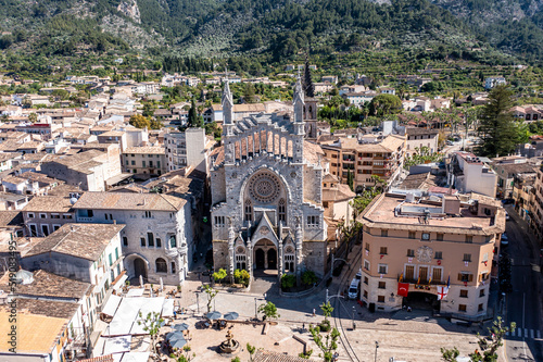 Spain, Balearic Islands, Soller, Helicopter view ofChurch of Saint Bartholomew and surrounding houses in summer photo