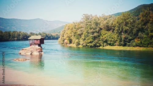 A beautiful view of the Lonely house on the river Drina in Bajina Basta, Serbia. Meditative calm footage.  photo