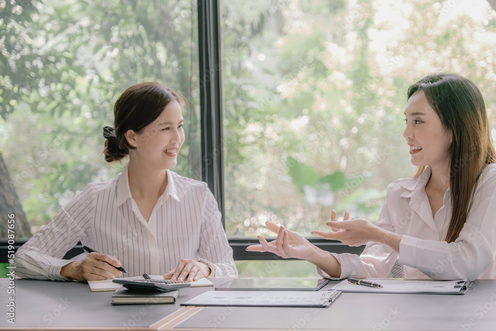 Marketer or analytic manager team dressed in suits working with paper charts and laptops at the meeting room. Marketer or analytic manager team dressed in suits working with paper charts and laptops at the meeting room.