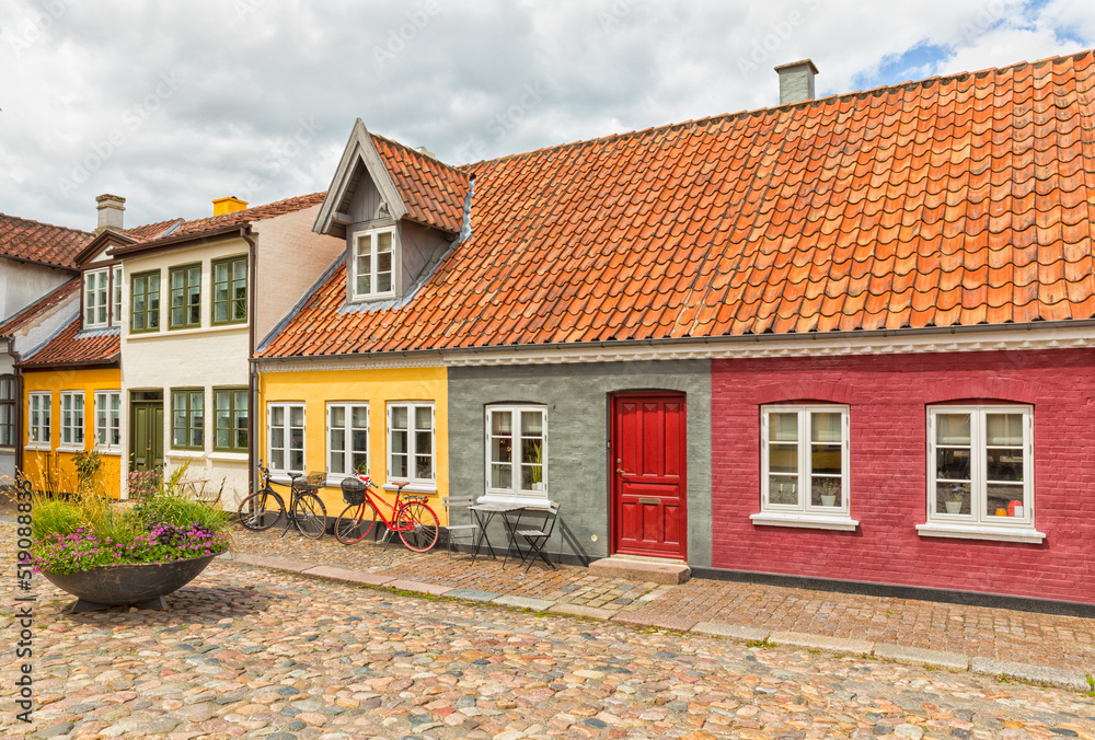 Idyllic cobbblestone alley at the old town of Odense, Denmark