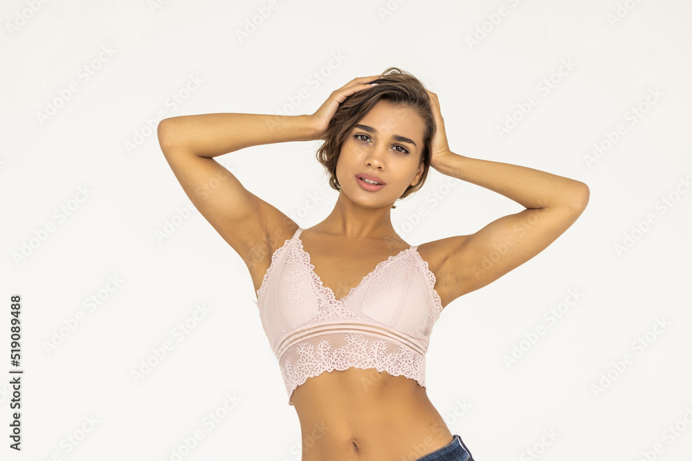 Obraz premium Beautiful young woman posing on white background