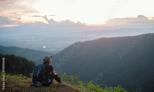 Happy woman with backpack hikes in the mountain with a beautiful view. Hikes mountain concept.