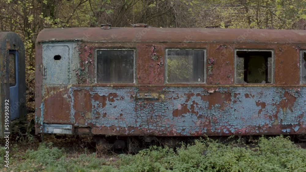 Camera movement along the rusty wagons of a narrow gauge railway Camera movement along the rusty wagons of a narrow gauge railway