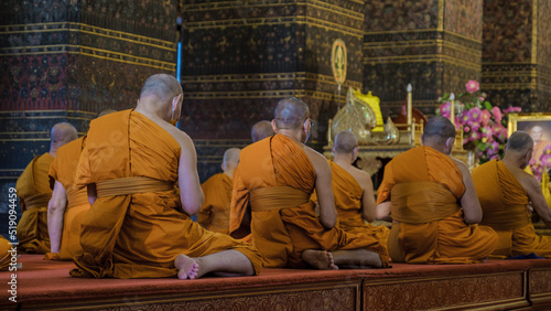 Wat Pho temple in Bangkok Thailand, The reclining buddha temple in Bangkok. Thai Buddhist monk meditation in temple photo