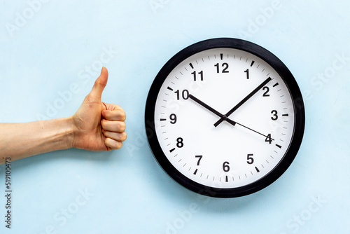 Round wall black and white clock with hands. Watch your schedule concept