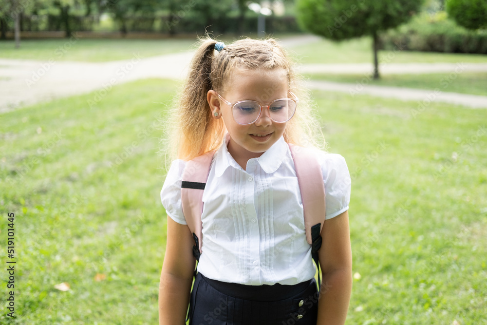 blonde schoolgirl in glasses white shirt with pink backpack back to school blonde schoolgirl in glasses white shirt with pink backpack back to school
