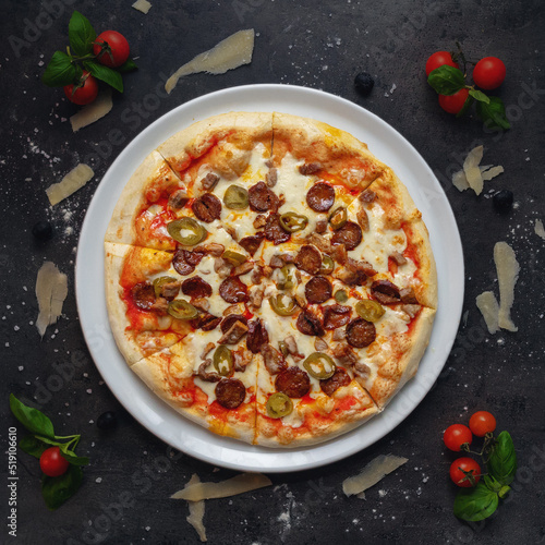 Traditional Italian Pizza with Homemade Tomato Sauce, debreceni Sasauges and Roasted Pork and Jalapeno, Picante style, Top Down Shoot, Appetizing Background photo
