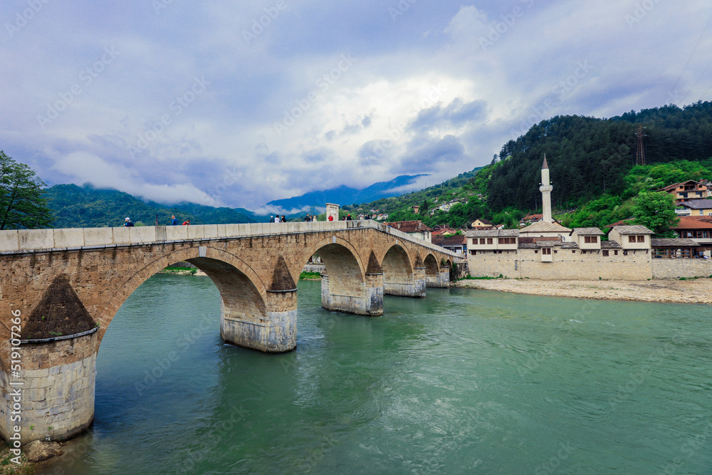 View in the Rainy Day to the historic Mehmed Paša Sokolović Bridge Bridge in Višegrad, over the Drina River, Bosnia and Herzegovina