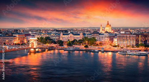 Illuminated evening cityscape of Budapest, capital of Hungary, Europe. Colorful summer view of Chain Bridge and St. Stephen's Basilica Church. Traveling concept background. © Andrew Mayovskyy
