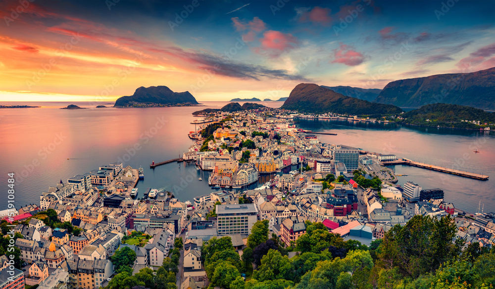 Picturesque summer view from flying drone of Alesund port. Great sunset in west coast of Norway, at the entrance to the Geirangerfjord. Traveling concept background.