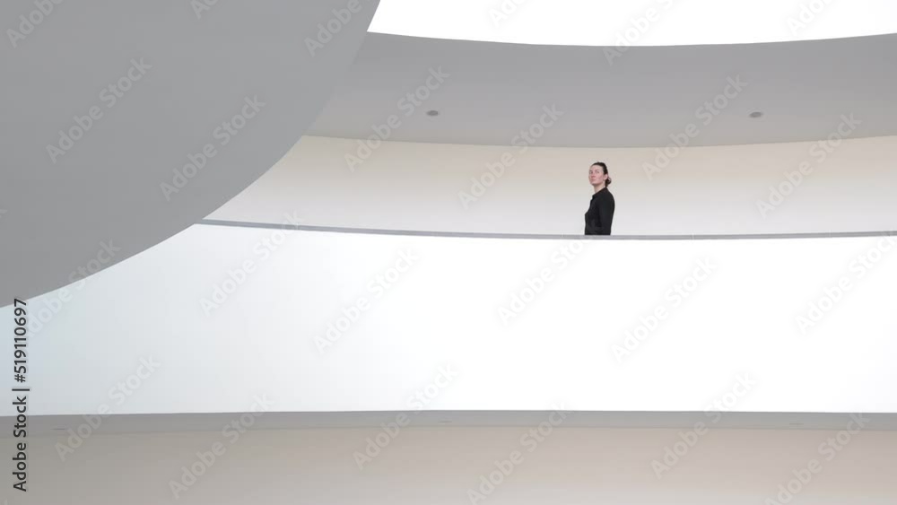 Businesswoman walking indoors holding tablet pc Businesswoman walking indoors holding tablet pc