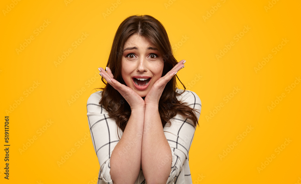 Amazed woman looking at camera Stock-Foto | Adobe Stock