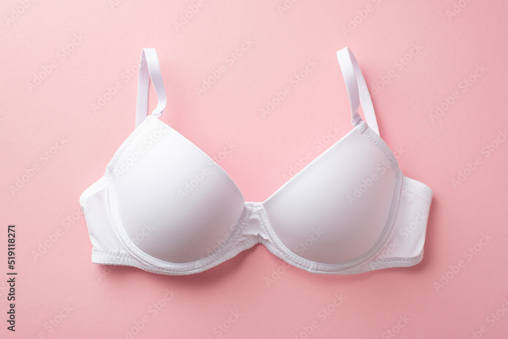 Breast cancer awareness concept. Top view photo of white brassiere