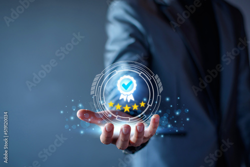 Quality Assurance Concept. Business people show high quality assurance mark, good service, premium, five stars, premium service assurance, excellence service, high quality, business excellence.