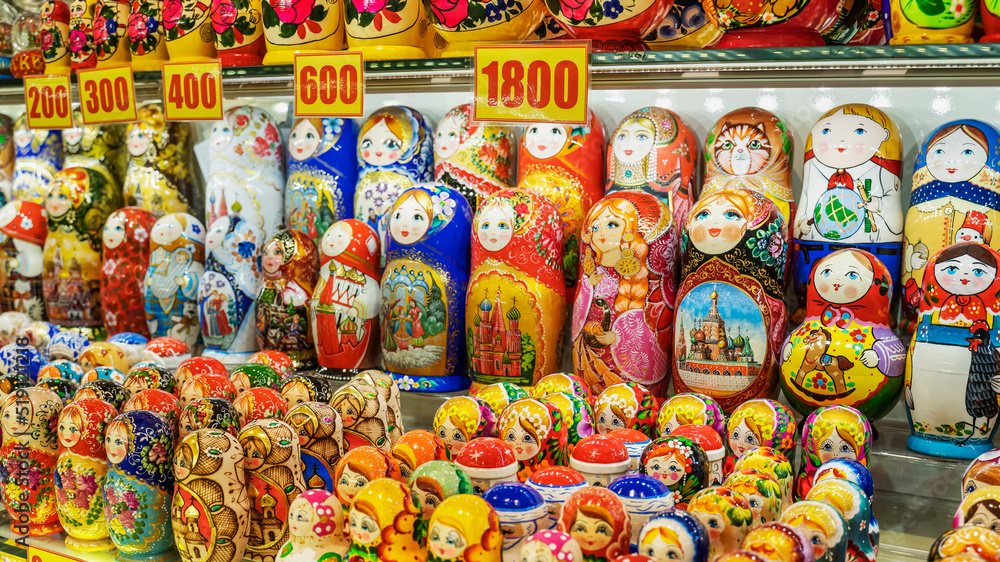 Rows of the Russian puzzle nesting dolls or Matryoshka dolls on display shop in the market. Selective focus.