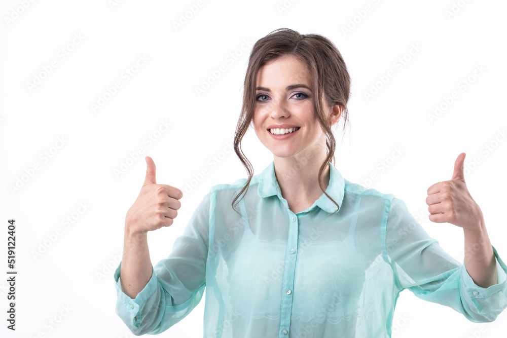 Portrait smiling woman in casual clothes showing thumbs up on white background Portrait smiling woman in casual clothes showing thumbs up on white background