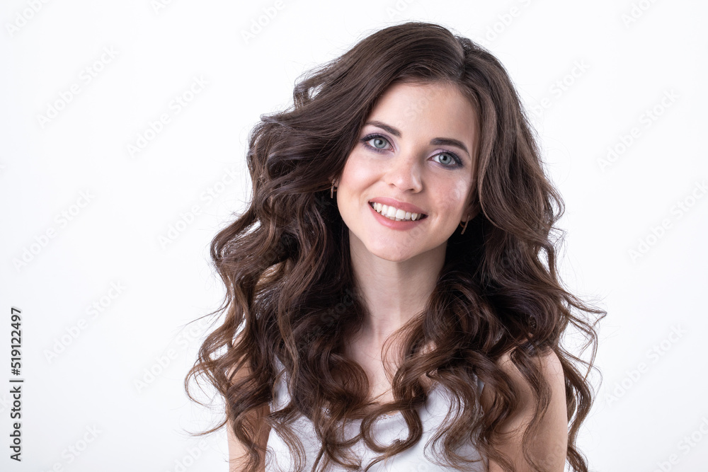 Portrait of a young beautiful woman with wavy hair in the studio on a white Portrait of a young beautiful woman with wavy hair in the studio on a white