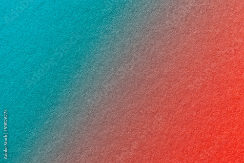Texture of old cyan and red paper background, with holographic gradient, macro. Structure of craft cerulean cardboard