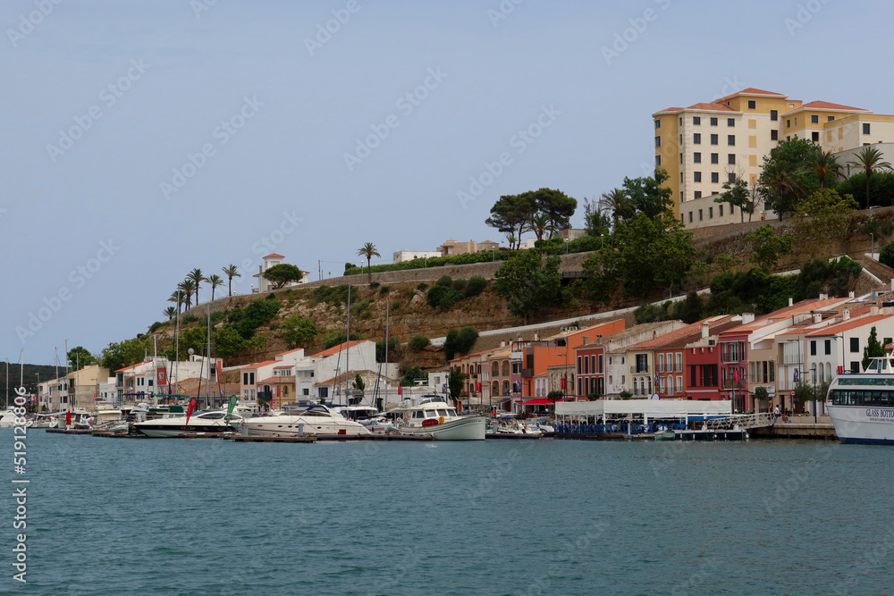 Mahon (Mao), Minorca (Menorca), Spain. Port of Mahon - the largest natural port in the Mediterranean Sea. Small islands, fortifications, villas, boats make beautiful scenery. View from the cruise boat