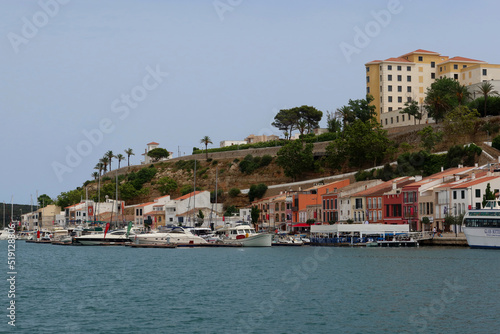 Mahon (Mao), Minorca (Menorca), Spain. Port of Mahon - the largest natural port in the Mediterranean Sea. Small islands, fortifications, villas, boats make beautiful scenery. View from the cruise boat