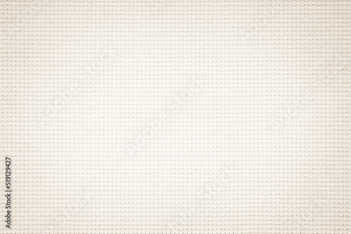 Fabric canvas woven texture background in pattern in light beige cream brown color.