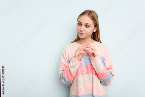 Young caucasian girl isolated on blue background making up plan in mind, setting up an idea.