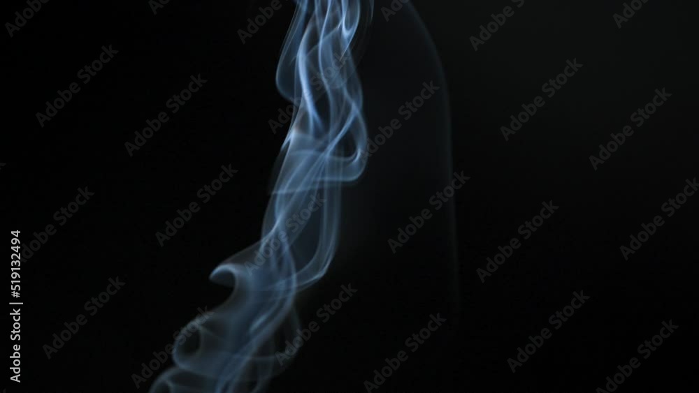 Abstract smoke rises up in beautiful swirls on a black background. Abstract smoke rises up in beautiful swirls on a black background.