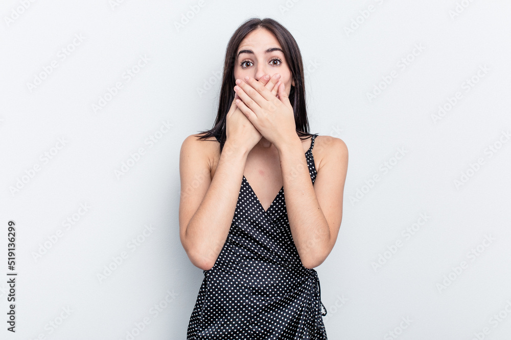 Young caucasian woman isolated on white background shocked covering mouth with hands. Young caucasian woman isolated on white background shocked covering mouth with hands.