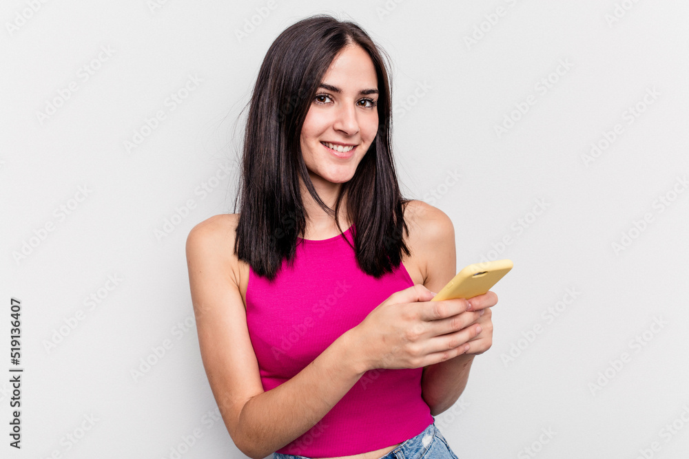 Young caucasian woman holding mobile phone isolated on white background