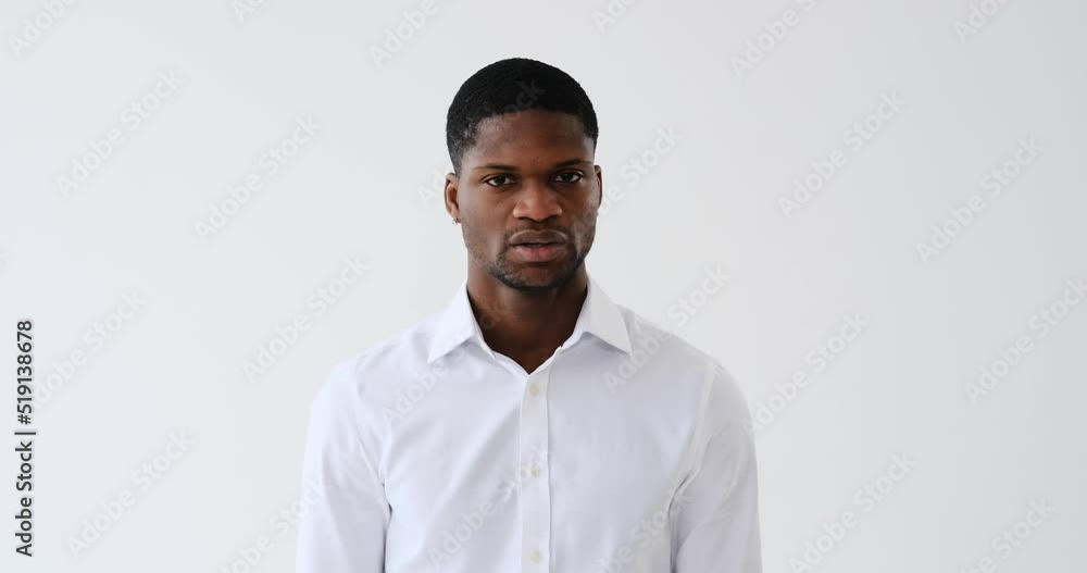 Serious african american businessman shaking head and saying no Serious african american businessman shaking head and saying no