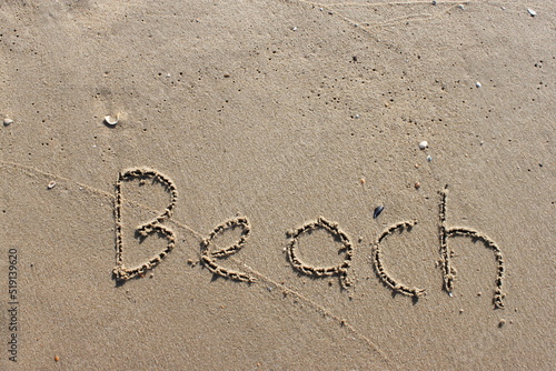 on the beach is carved with letters in the smooth sand the writing Beach © Marcus