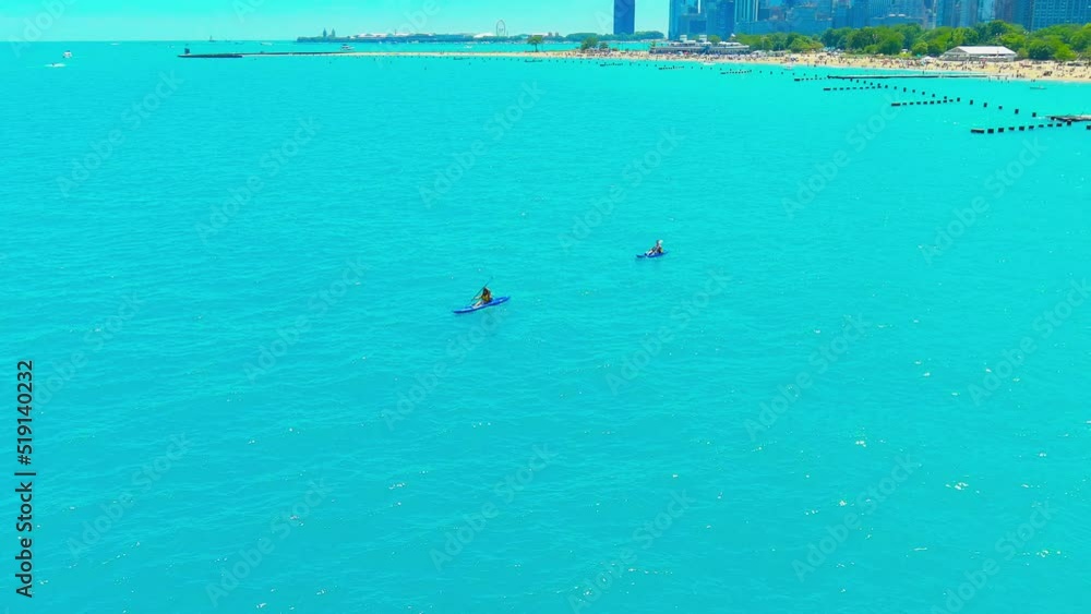Aerial flyby of people kayaking at North Avenue beach in Chicago Illinois | Afternoon Lighting Aerial flyby of people kayaking at North Avenue beach in Chicago Illinois | Afternoon Lighting
