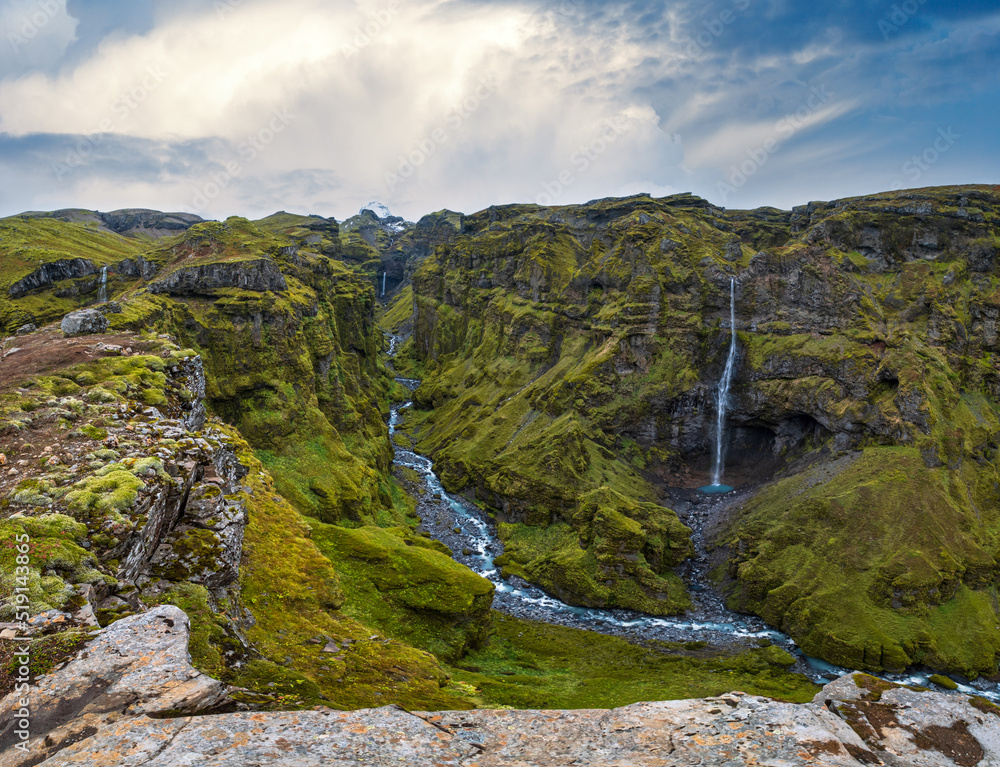 Beautiful autumn Mulagljufur Canyon, Iceland. It is located not far from Ring Road and Fjallsarlon glacier with Breidarlon ice lagoon at the south end of Vatnajokull icecap and Oraefajokull volcano.