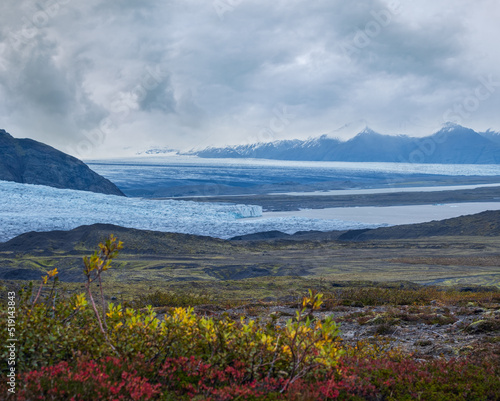 Beautiful autumn view from Mulagljufur Canyon to Fjallsarlon glacier with Breidarlon ice lagoon, Iceland. Not far from Ring Road and at the south end of Vatnajokull icecap and Oraefajokull volcano. photo