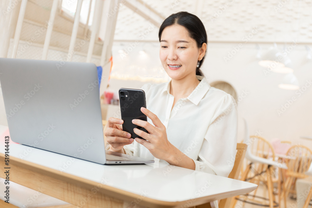 woman work using texting cell phone typing computer.student study education online learning.adult professional chatting on laptop,mobile contact us at Thinking business plan.connecting people concept woman work using texting cell phone typing computer.student study education online learning.adult professional chatting on laptop,mobile contact us at Thinking business plan.connecting people concept