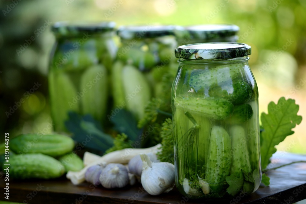 Jars of pickled cucumbers, fermented cucumbers, pickles, dill, garlic, horseradish and herbs. Jars of pickled cucumbers, fermented cucumbers, pickles, dill, garlic, horseradish and herbs.