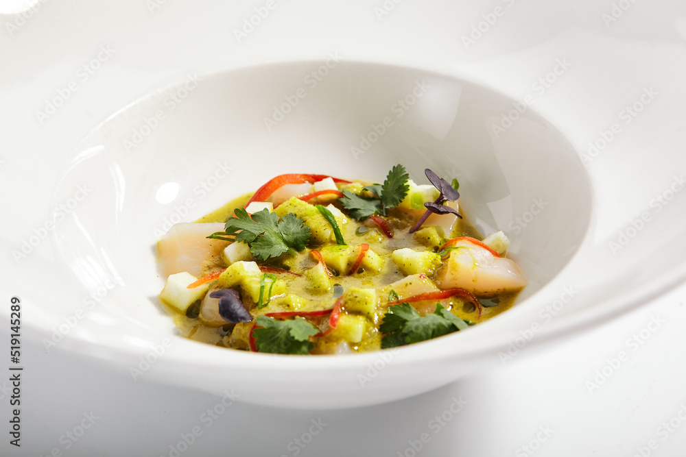 Scallop in light apple dressing in plate Scallop in light apple dressing in plate