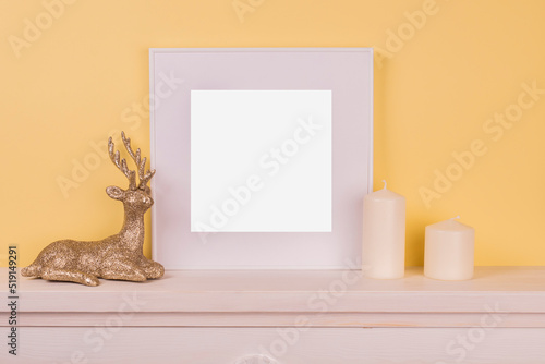Mock up poster. Minimal template with empty picture frame mock up. Minimalist Christmas interior decoration, candle