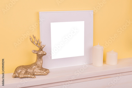 Mock up poster. Minimal template with empty picture frame mock up. Minimalist Christmas interior decoration, candle